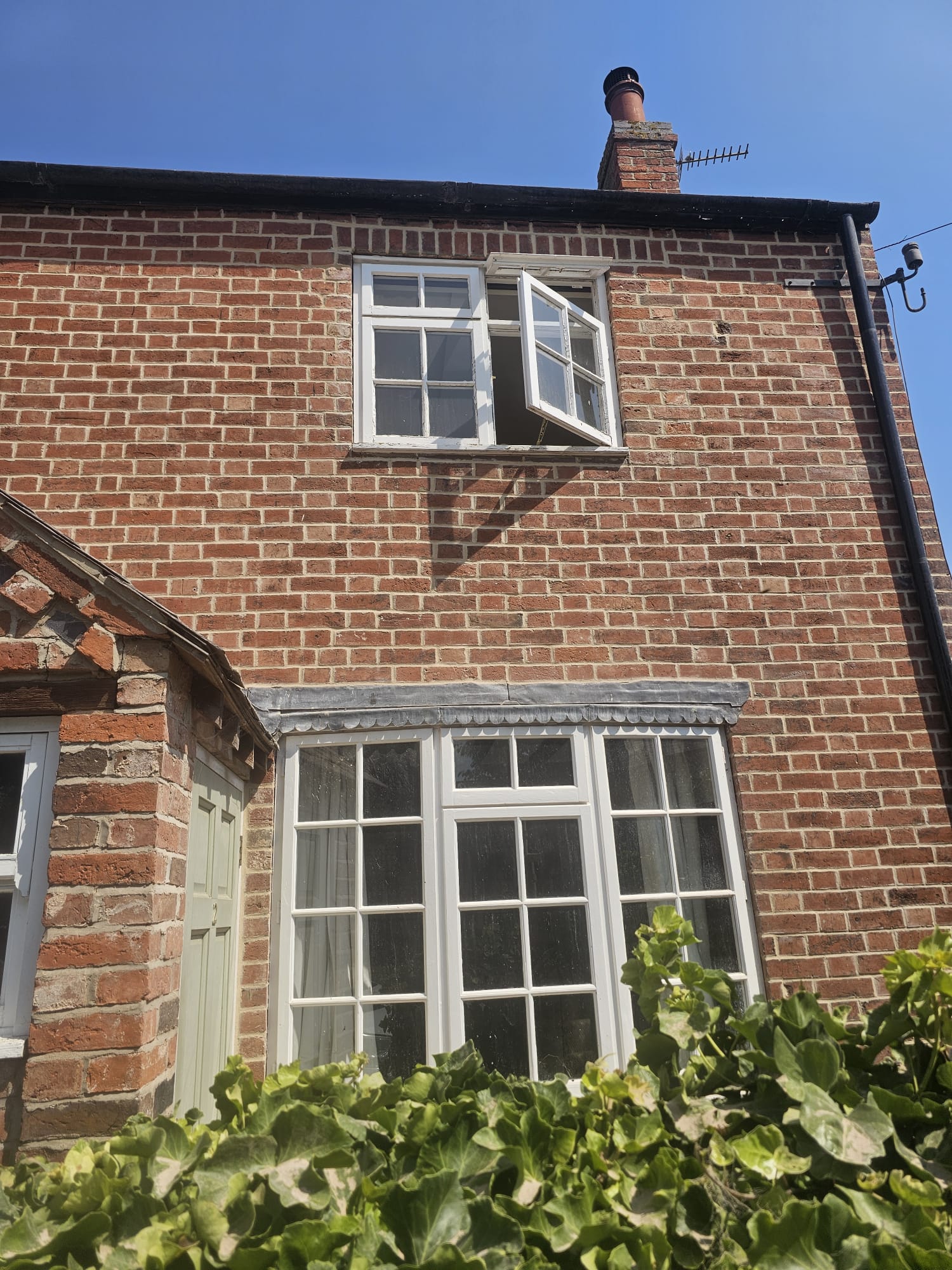 Before and after of house that has been repointed